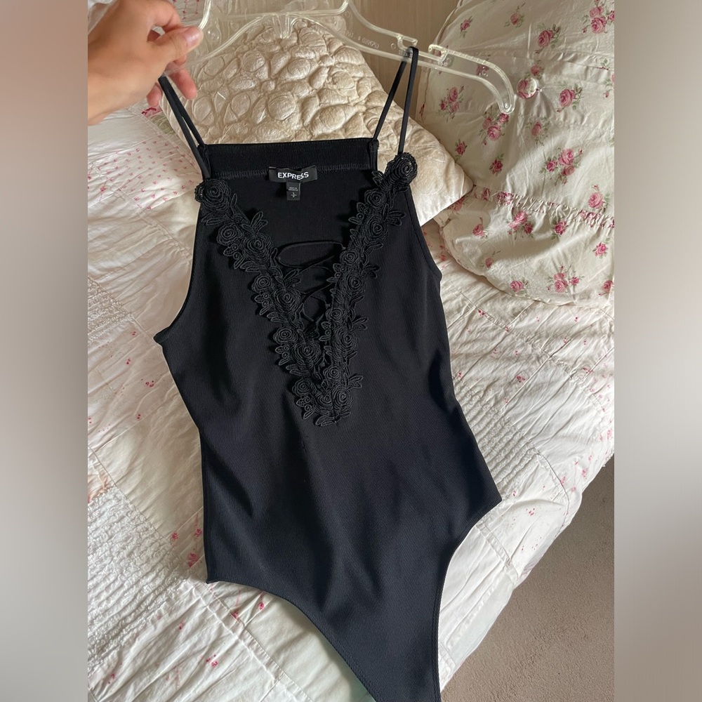 Express body suit with deep v-cut design